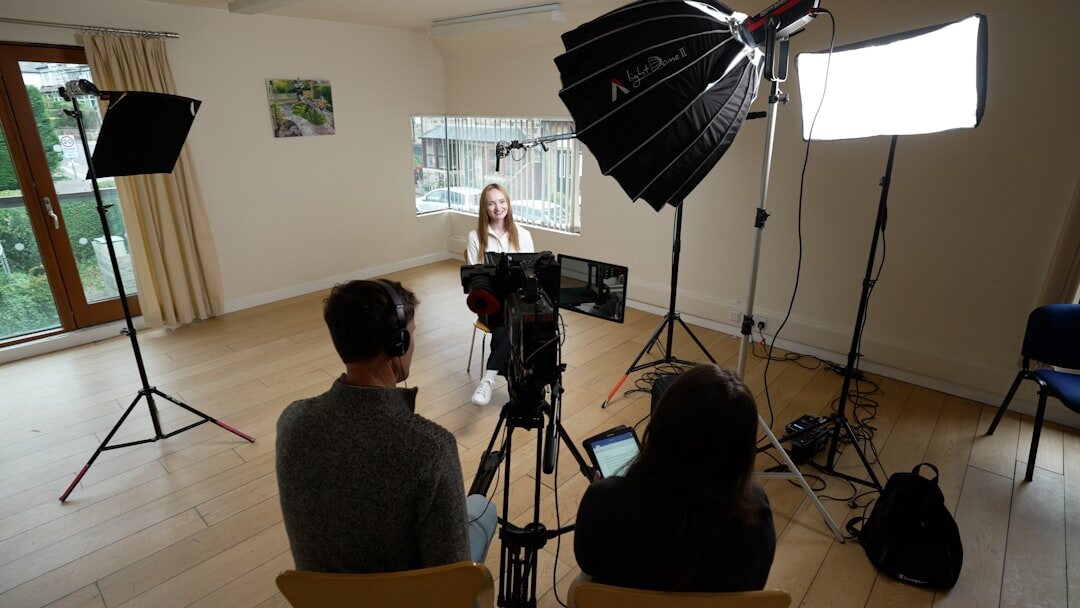 Professional broadcast camera on tripod in a TV studio